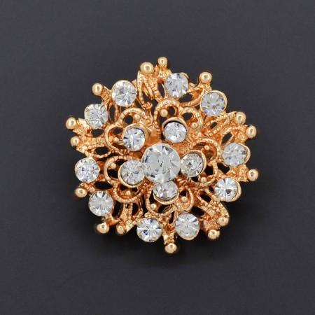 Приглядная брошь с фианитами в позолоте DI 421-41 фото | Brulik