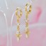 Подвесные позолоченные серьги с фианитами 18K 10-9230 фото | Brulik